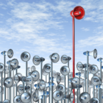 Image of red megaphone raising above all the rest.