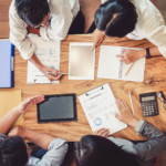 4 people working in a desk